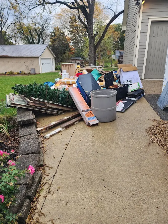 Dumpster being loaded with debris for Commercial Dumpster Rental in Riverton